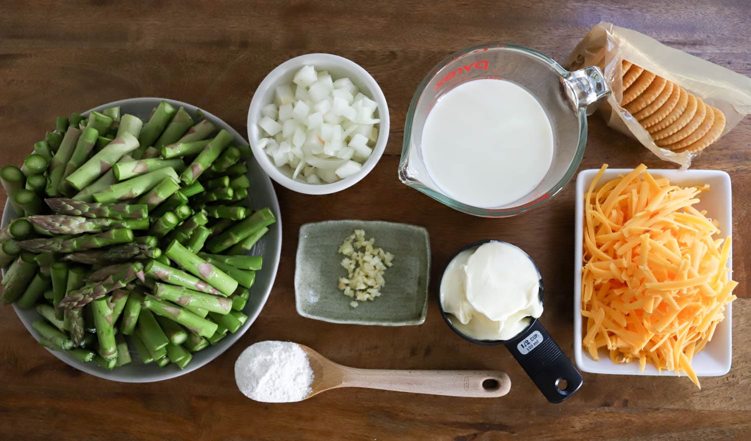 ingredients for easy asparagus casserole on wooden board.