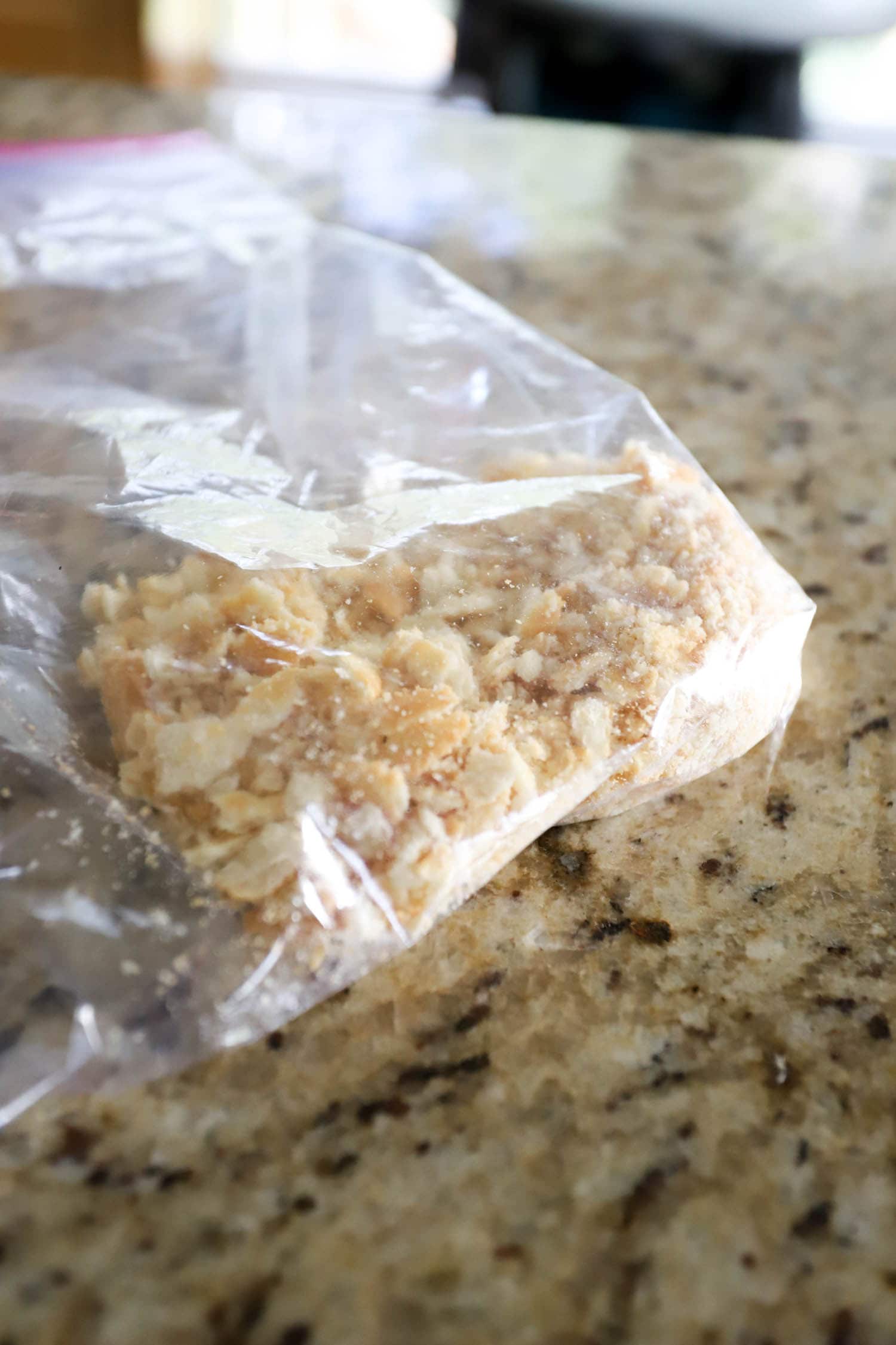 ritz crackers crushed in a ziploc bag.