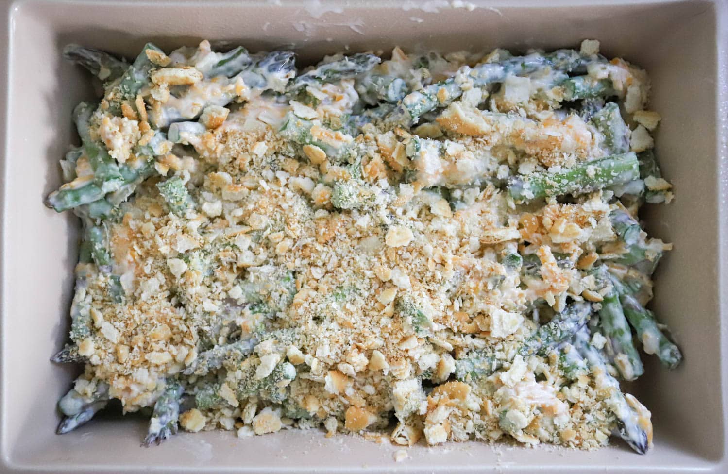asparagus casserole uncooked in baking dish.