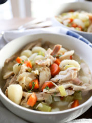 white bowl with gnocchi chicken and dumplings.
