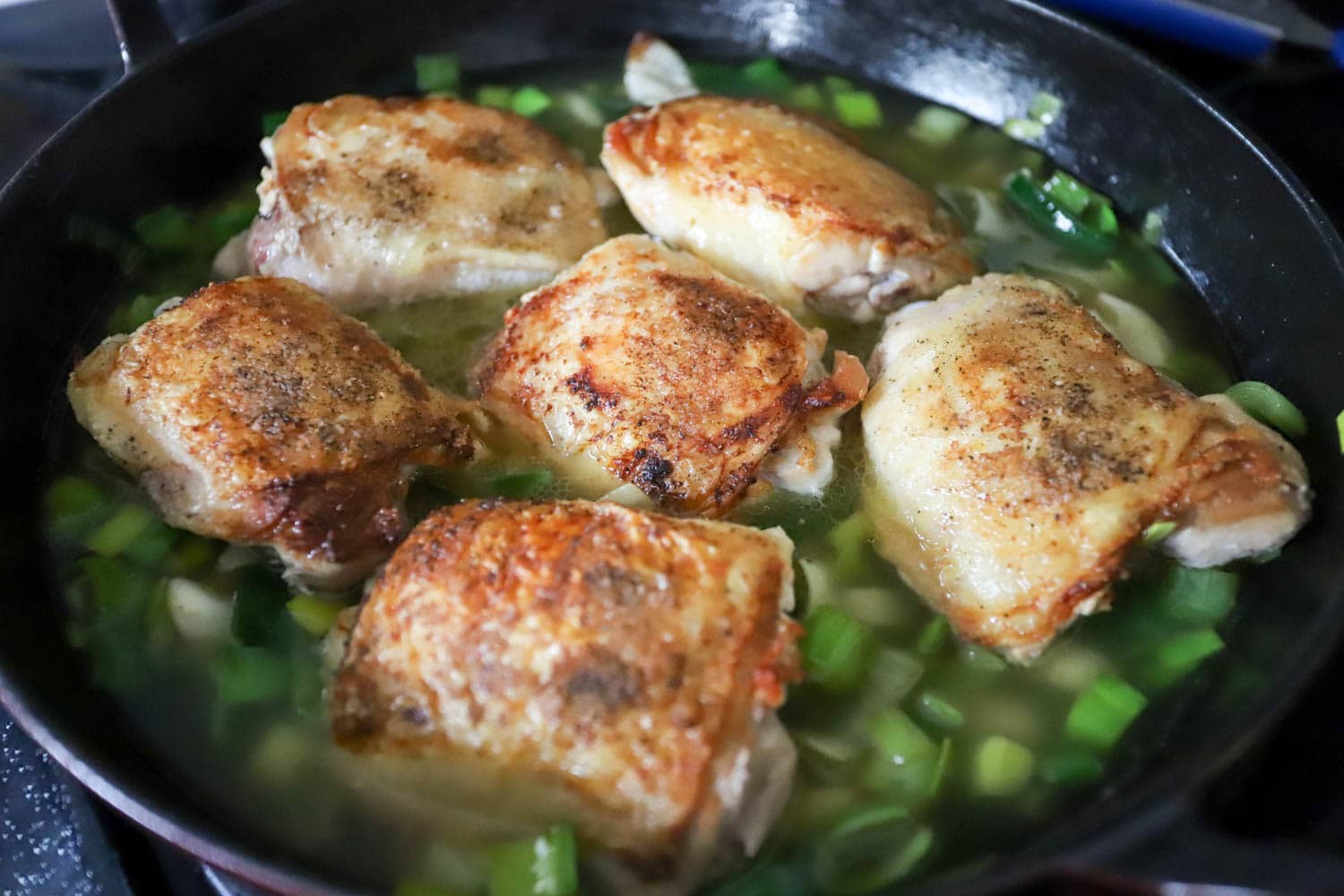 chicken with leeks in a large skillet.