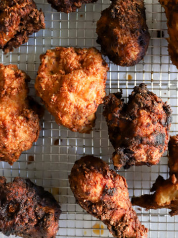buttermilk fried chicken on wire cooling rack