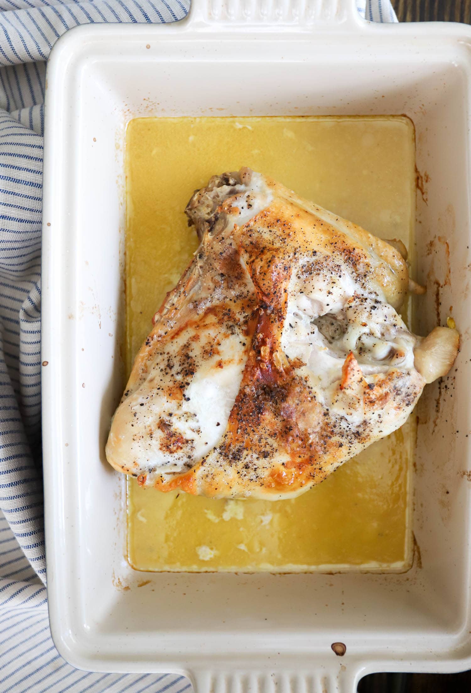 roast turkey breast in a shallow baking dish with salt and pepper.