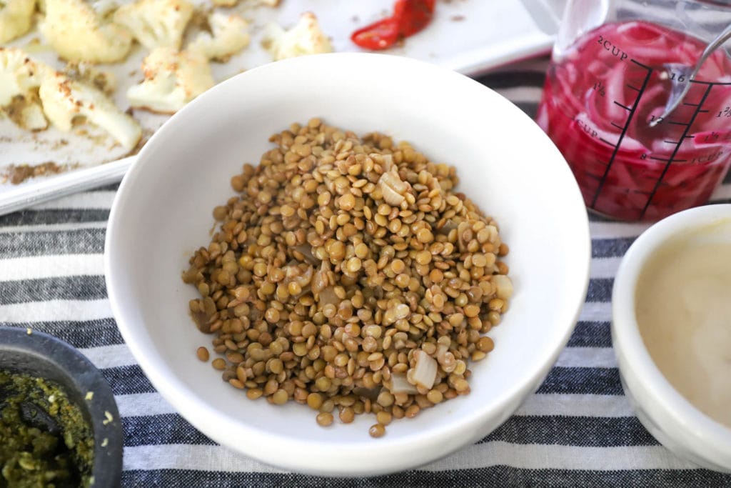 shallow bowl of lentils with onions