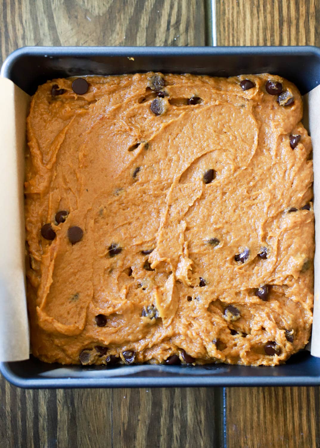 pan of unbaked blondie batter with chocolate chips.