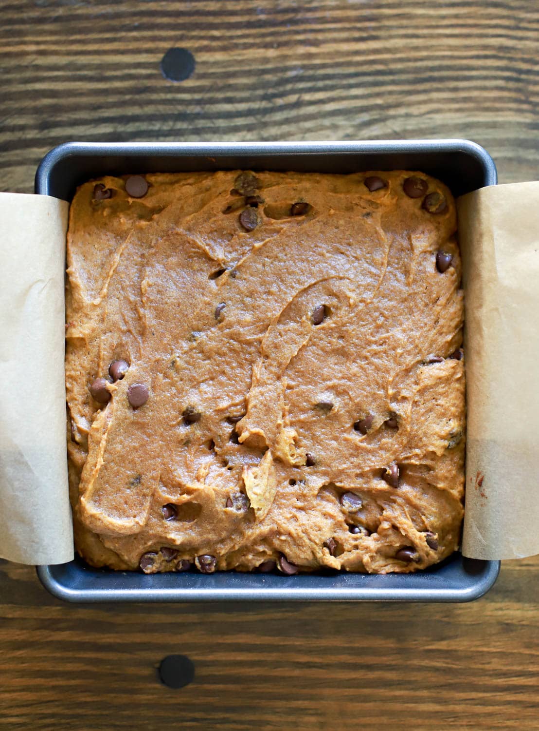 pan of uncut blondies with chocolate chips.