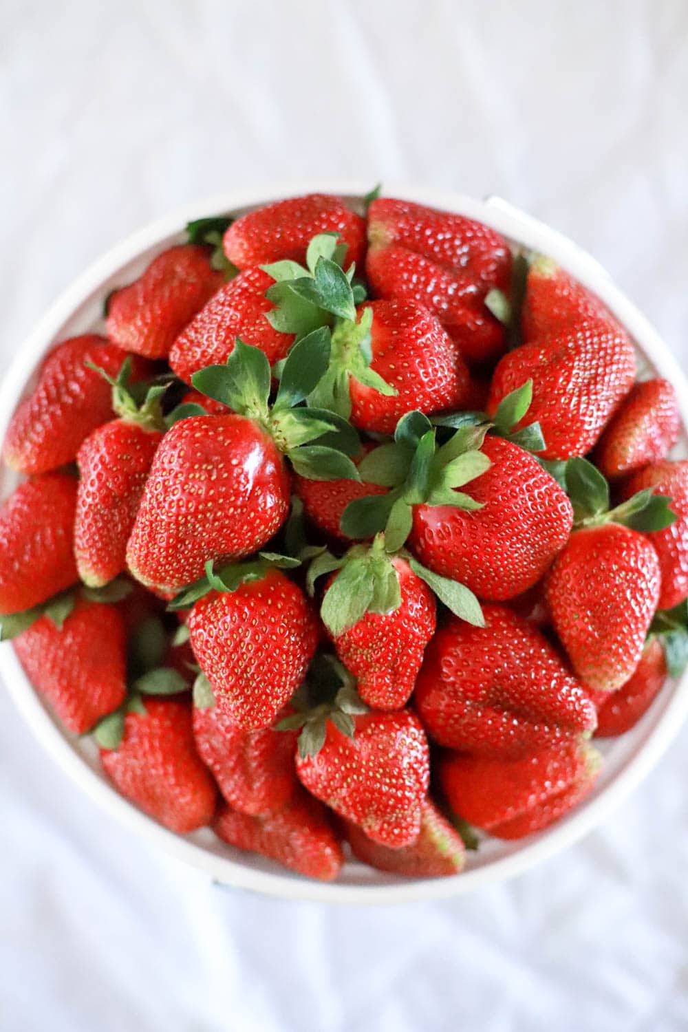 gallon of fresh summer strawberries