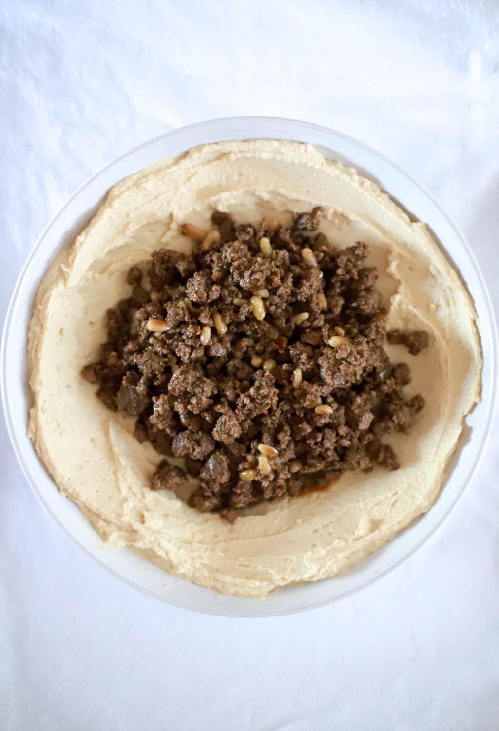 Spiced Ground Meat with Pine Nuts over Hummus Recipe