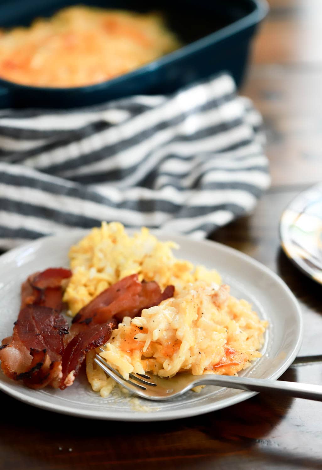 side view of plate with bacon and hash brown casserole.