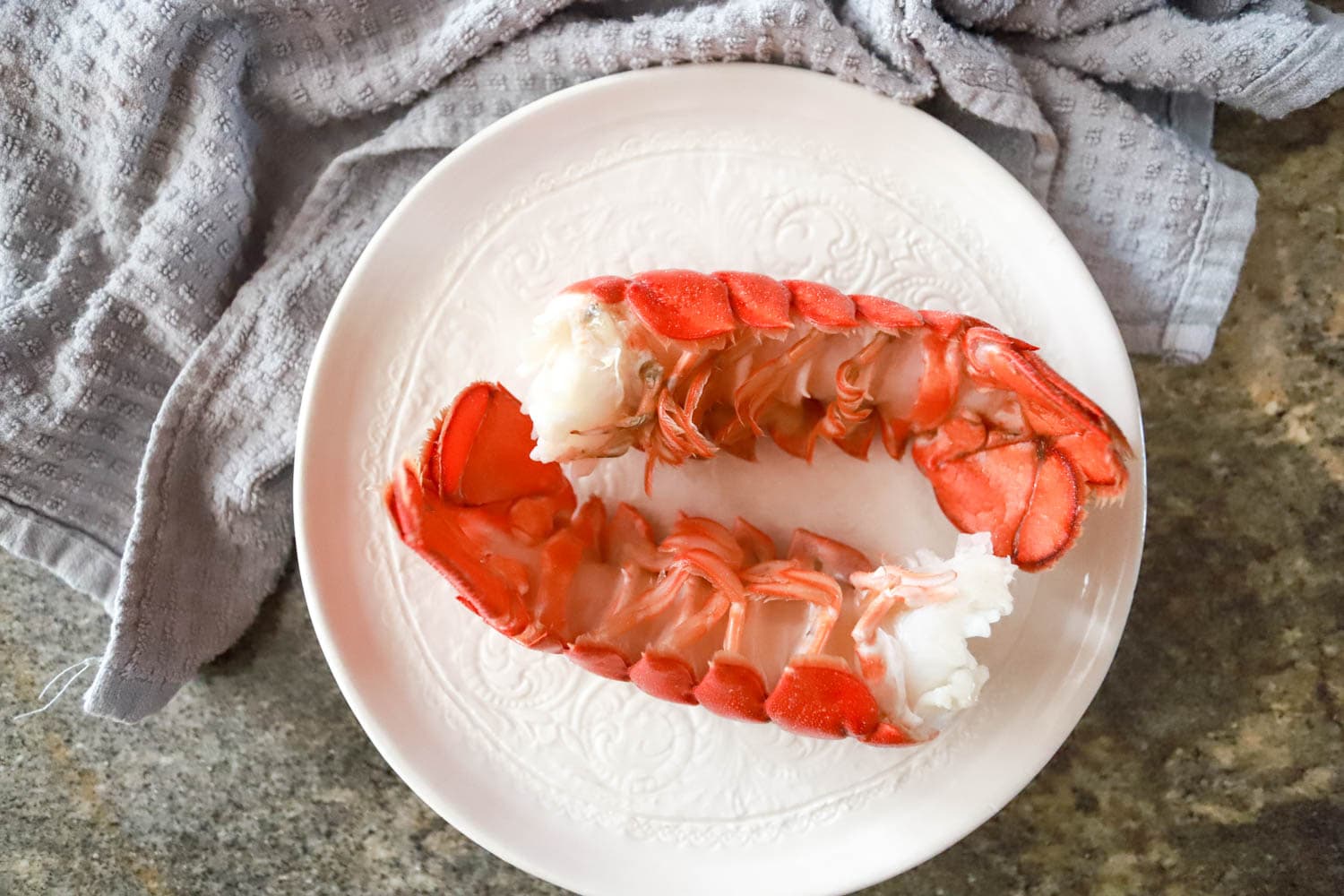 Cooked and cooled lobster tails.