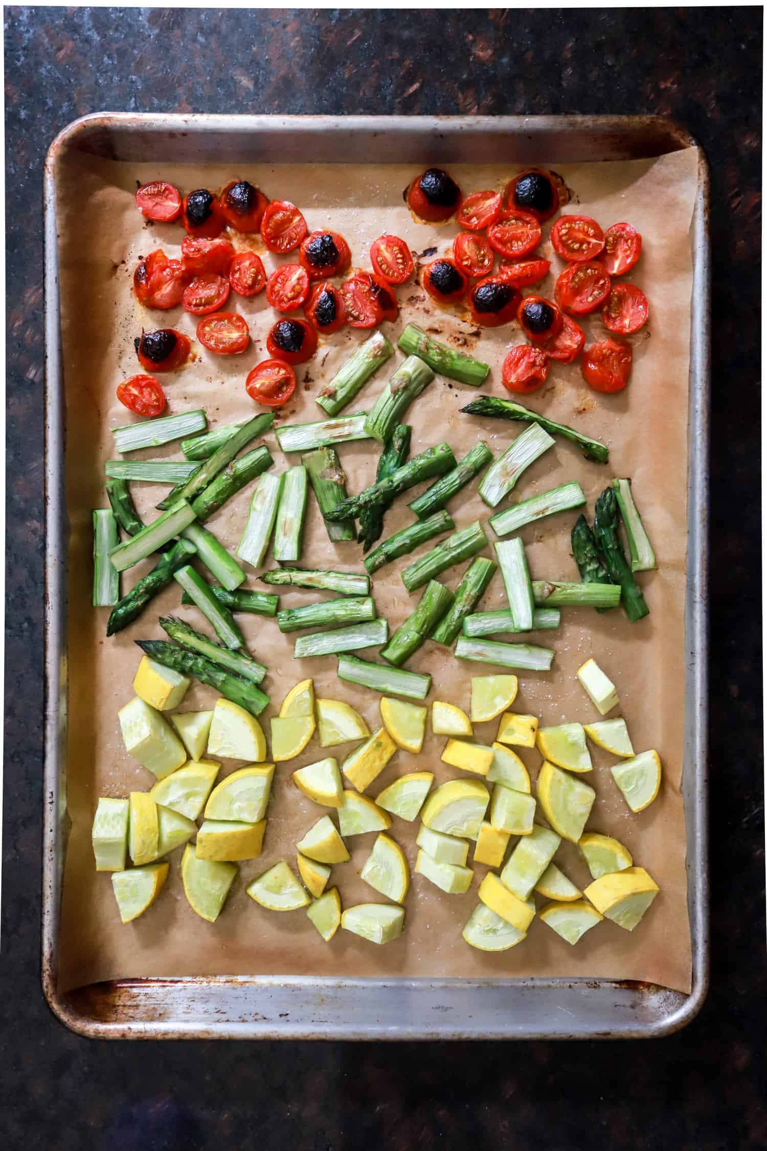 broiled tomatoes asparagus and squash on sheet pan