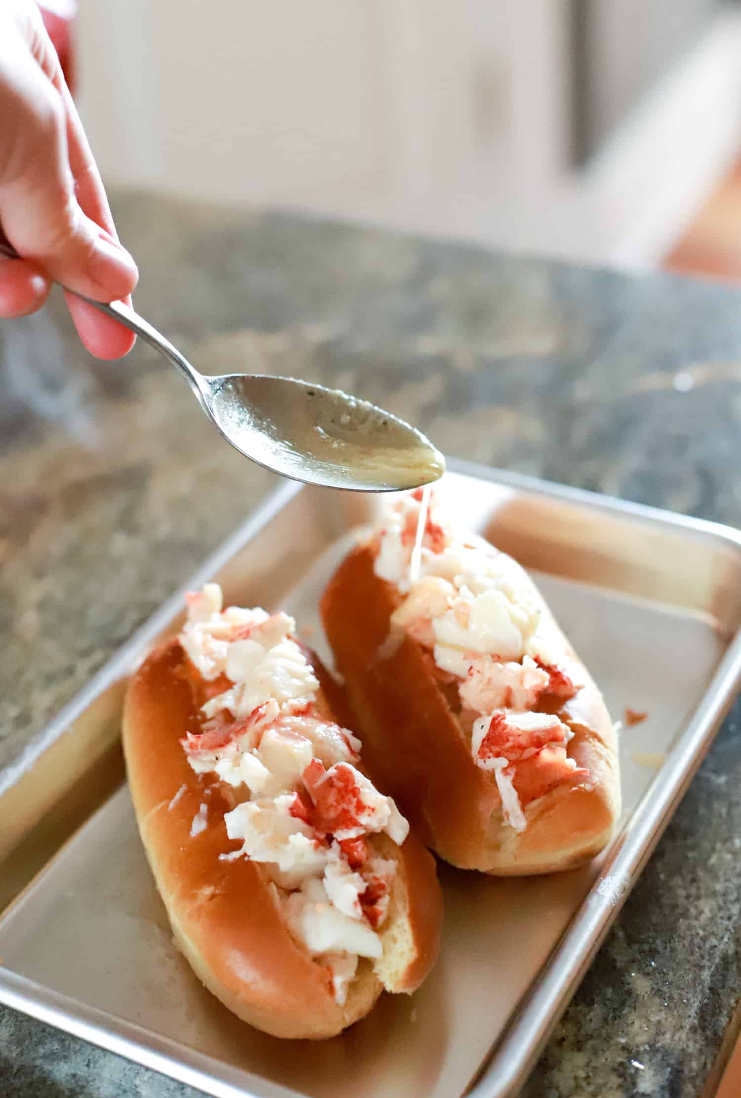 butter drizzle over connecticut lobster roll