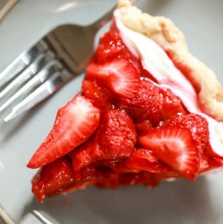 slice of cream cheese strawberry pie with plate and fork