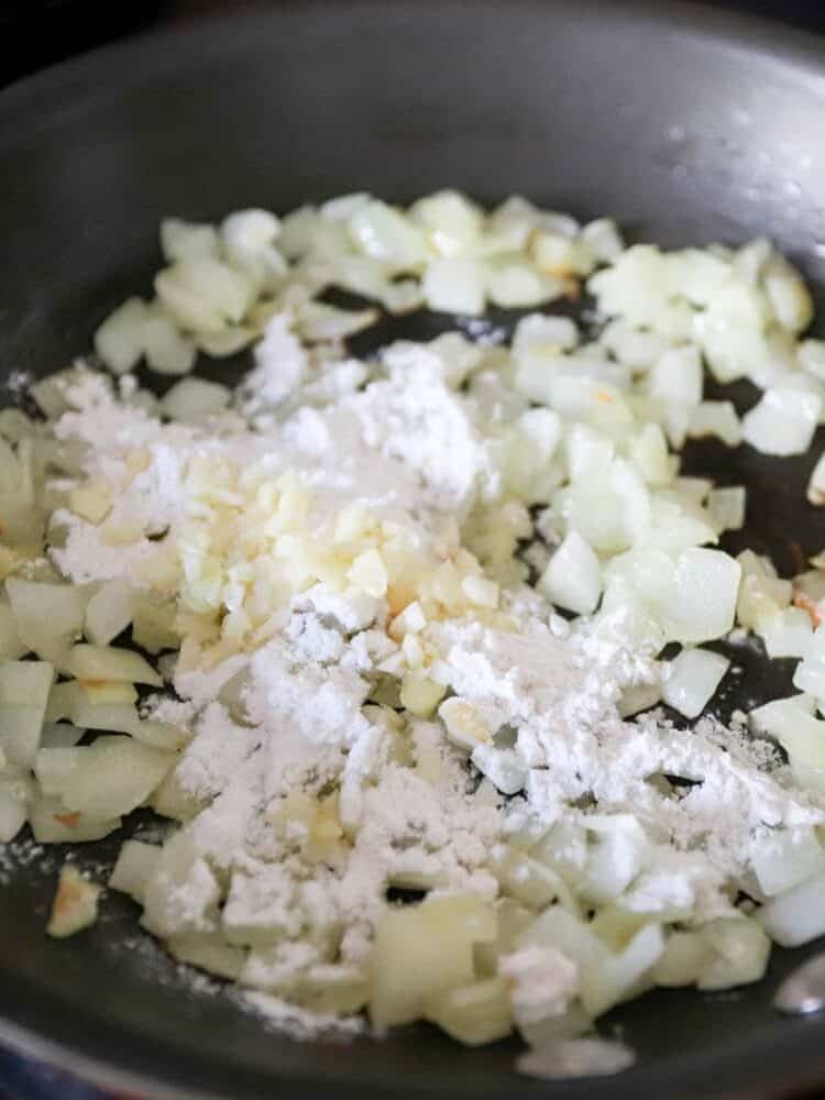 Skillet with sauteed chopped onions and garlic.